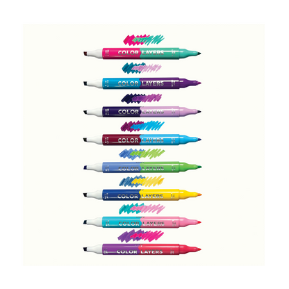 Row of uncapped markers and layered swatches from the OOLY Color Layers Marker set
