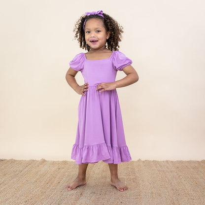 Toddler modeling Puff Sleeve Twirl Dress in Poi