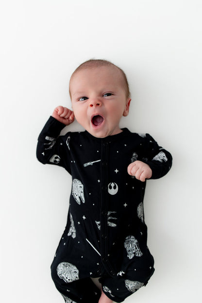 Yawning infant wearing the Romper in STAR WARS™