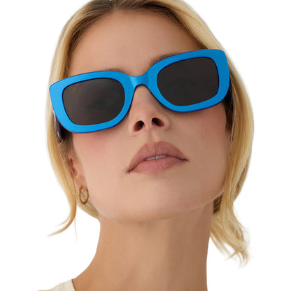on model - blonde female wearing diff eyewear romy square sunglasses with a luminous blue acetate frame and grey lenses front view