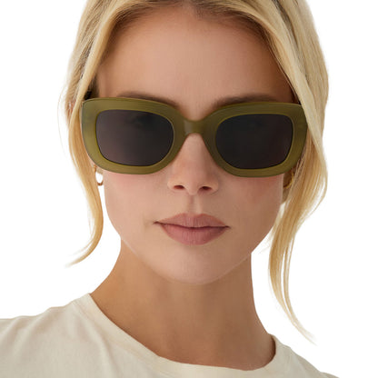 on model - blonde female wearing diff eyewear romy square sunglasses with a sweet pea green acetate frame and grey lenses front view