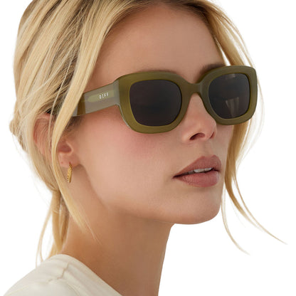 on model - blonde female wearing diff eyewear romy square sunglasses with a sweet pea green acetate frame and grey lenses angled view