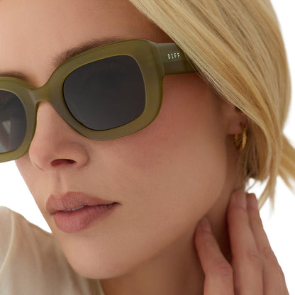 on model - blonde female wearing diff eyewear romy square sunglasses with a sweet pea green acetate frame and grey lenses detailed view