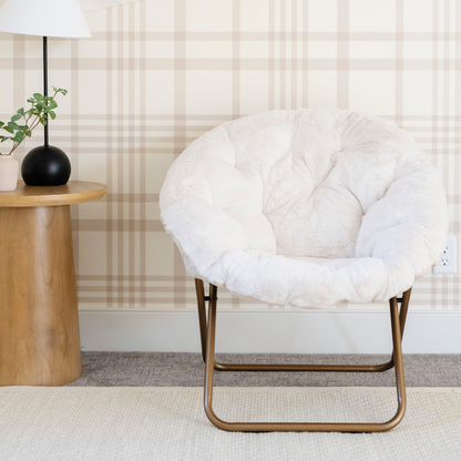 A cozy cream Saranoni faux fur saucer chair, featuring a soft, removable faux fur cover made from the same luxurious fabric as Saranoni’s blankets. This stylish and foldable saucer chair offers a safe, comfortable space for kids to relax, read, or play. Perfect for adding warmth and texture to any room, it’s a must-have for creating a kid-friendly lounging spot.