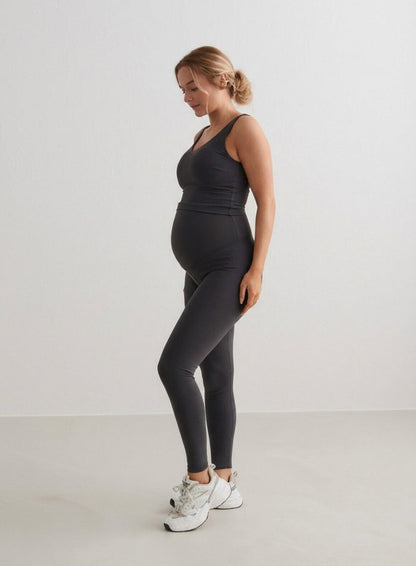 A pregnant woman wearing Shadow Grey Sense Maternity Tights and a matching tank top from aim'n.