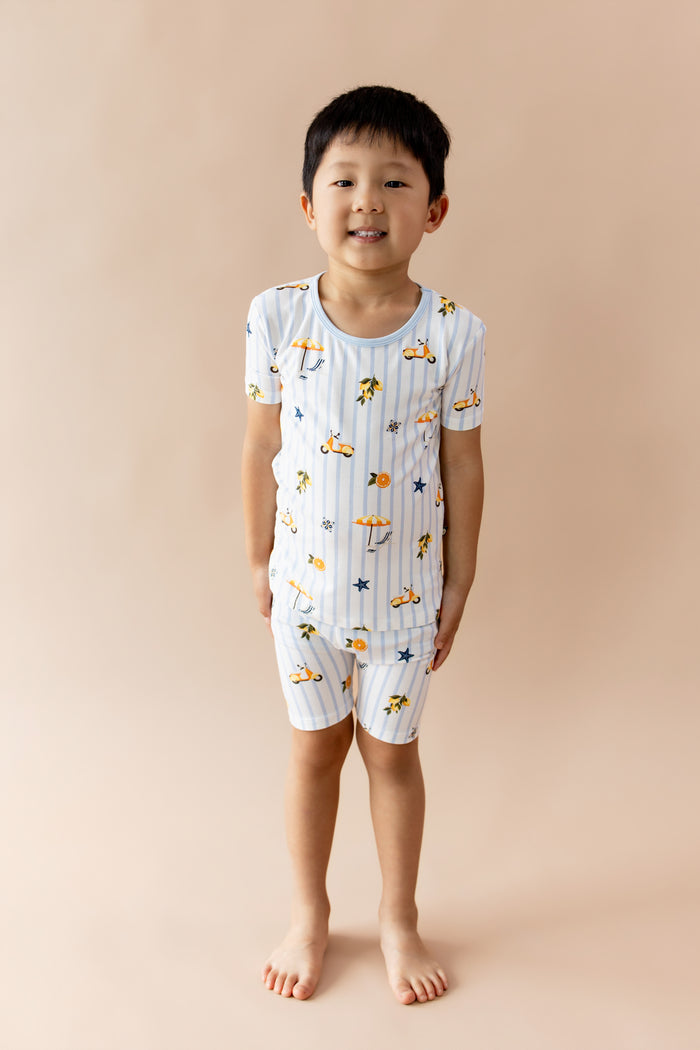 Young boy posing wearing the Short Sleeve Pajamas in Amalfi Coast