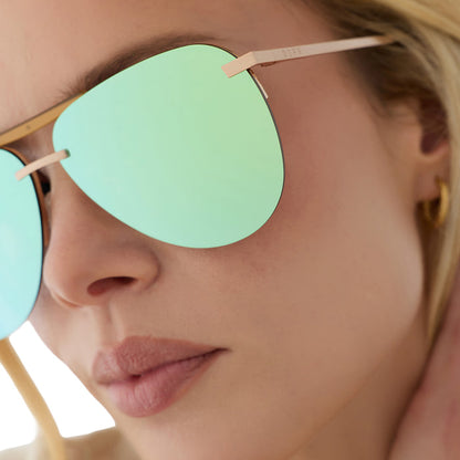 on model - blonde female wearing diff eyewear tahoe oversized aviator sunglasses with a gold metal frame and dew drop blue mirror polarized detailed view