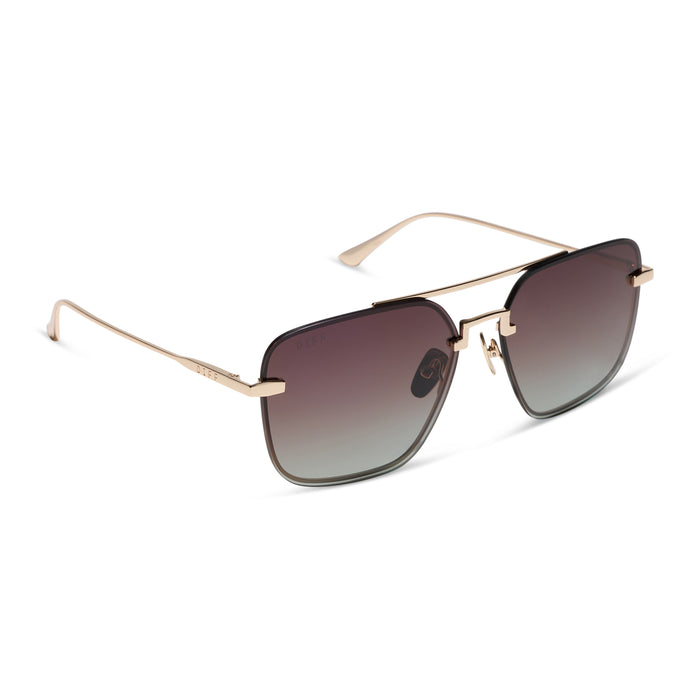 diff eyewear teddy oversized navigator sunglasses with a gold metal frame and brown gradient polarized lenses angled view