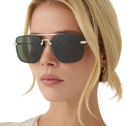 on model - blonde female wearing diff eyewear teddy oversized navigator sunglasses with a silver metal frame and g15 lenses angled view