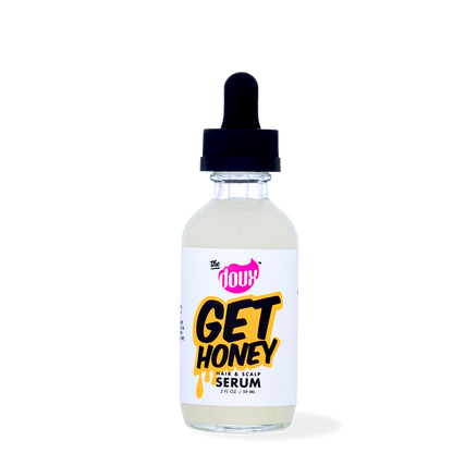 A bottle of The Doux Get Honey Hair & Scalp Serum with a dropper cap.