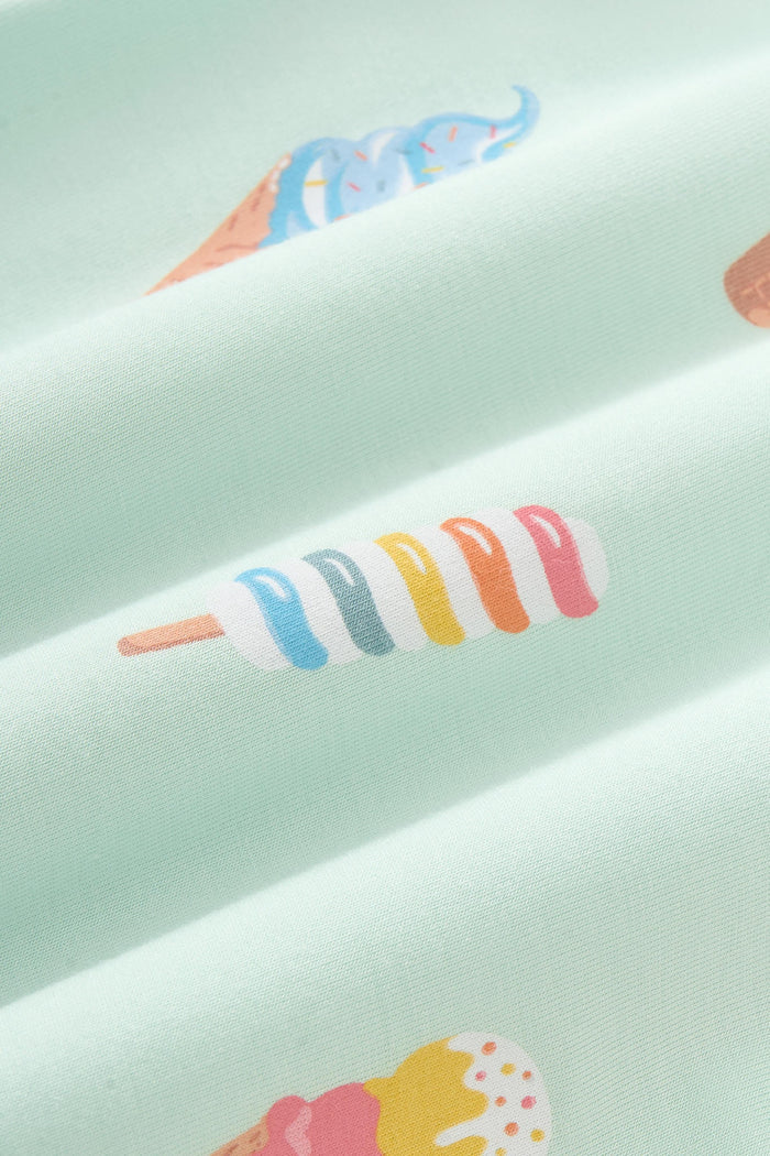 Close up of colorful Ice cream print on green fabric