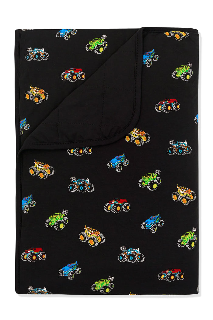 Colorful Monster truck print on Black Toddler Blanket on white background