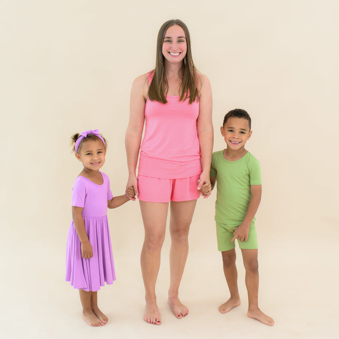 Family wearing matching bamboo outfits in Hawaiian inspired colors