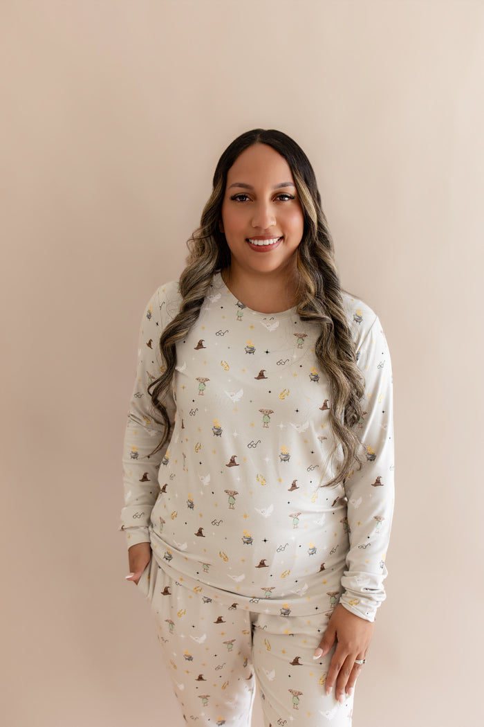 Women wearing a beige Harry Potter patterned joggers set on a beige background