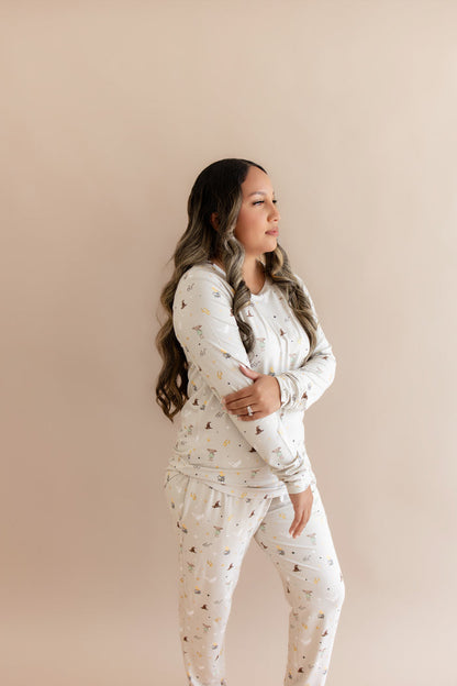 Women wearing a cream Harry Potter patterned joggers set on a beige background