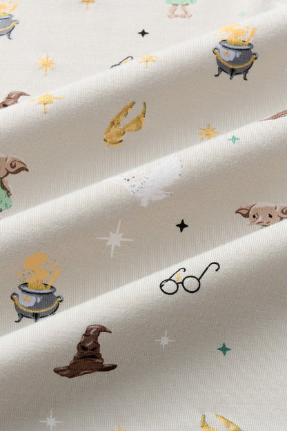 Close up of Beige fabric with Starry Icon Harry Potter patten print