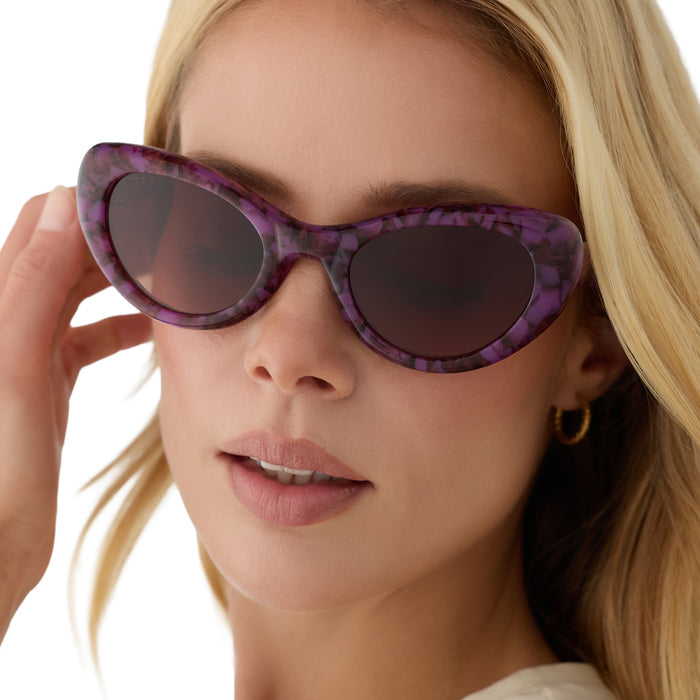 on model - blonde female wearing diff eyewear zaria cat eye sunglasses with a lavender haze purple tortoise acetate frame and brown gradient lenses front view