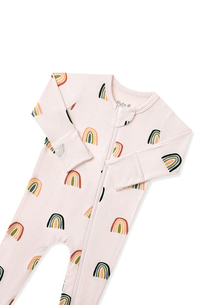 Vanilla cream Zippered Footie in Retro Rainbow print with zipper garage on a white background