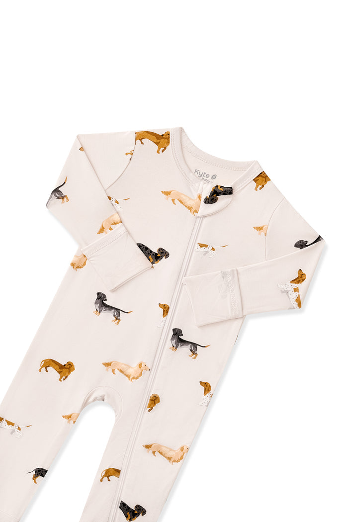 Top part of Beige Zippered Romper in Dachshund print on a white background