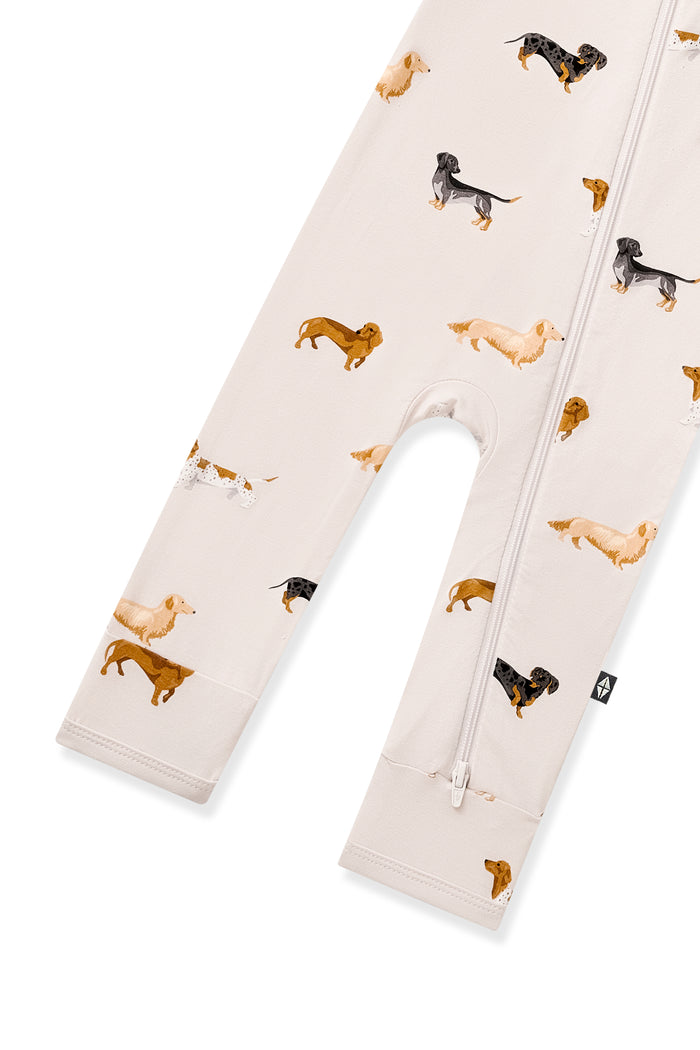 Bottom part of Beige Zippered Romper in Dachshund print on a white background