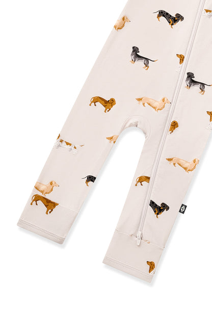 Bottom part of Beige Zippered Romper in Dachshund print on a white background